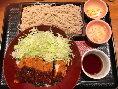 Bowl of rice topped with miso sauce pork cutlet and Shredded cabbage ,soba, japanese pickles at ootoya