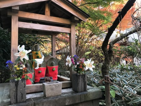 Autumn leaves and Jizo statue in Meigetsuin in Kamakura